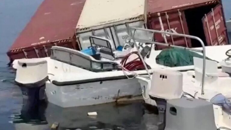 Iranian fishermen hunt for iPhones and perfume after cargo ship sinks in Hormuz