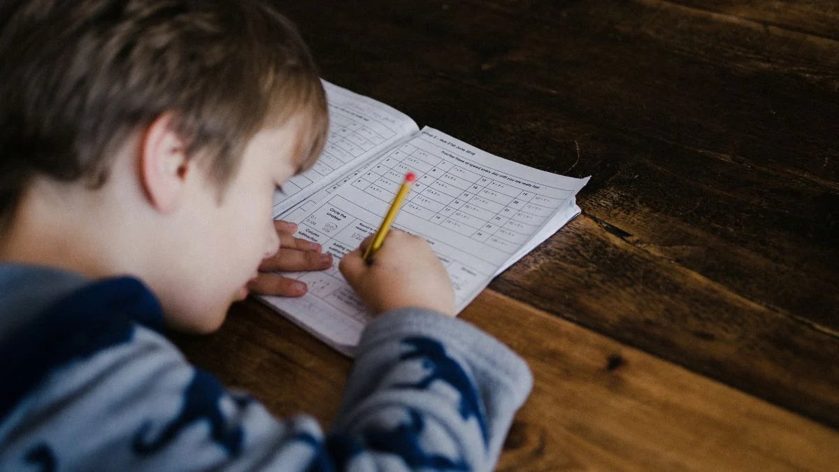 Child completing maths homework