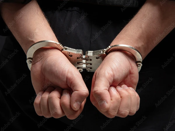 handcuffs in hands1780346840 0