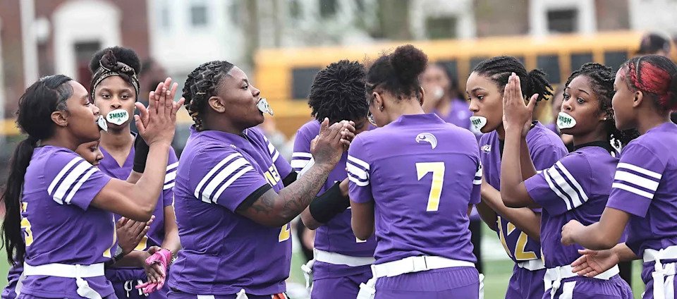 Aiken's flag football team talks during the Falcons' 14-0 win over Western Hills Friday, April 4, 2025.