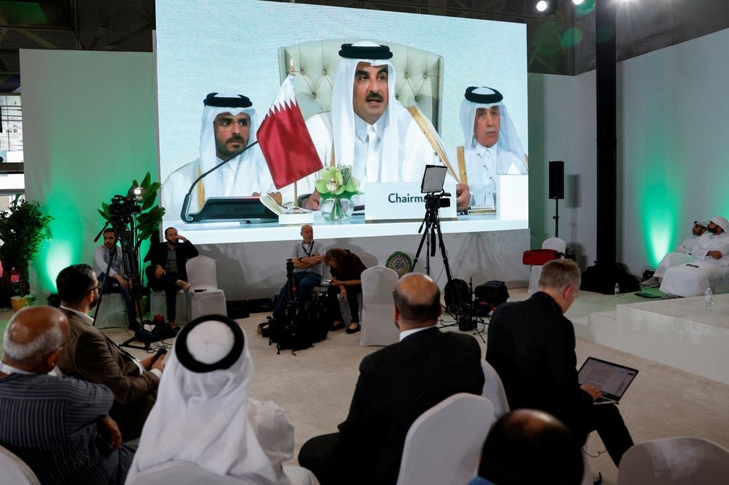 A screen shows Qatar’s emir speaking on Monday at the emergency Arab-Islamic summit held to discuss the Israeli attack on Qatari soil. Photo: Reuters