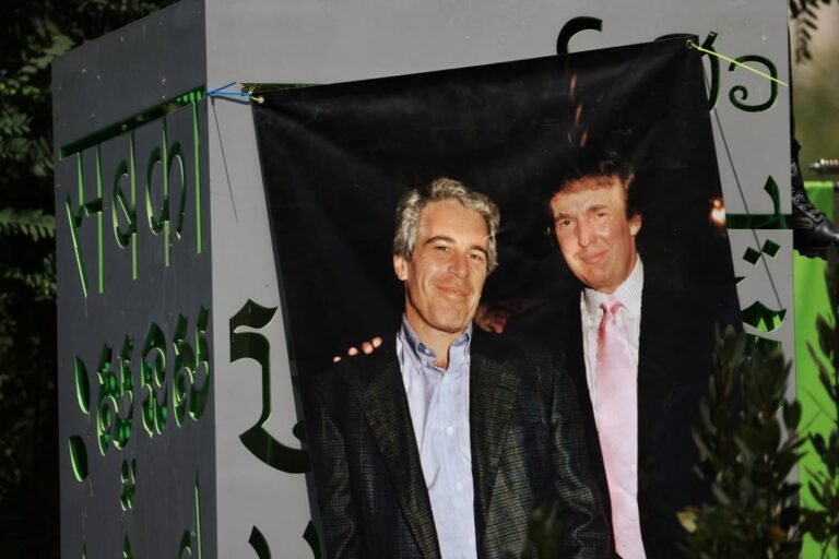 A banner in downtown Los Angeles in August showing an old photo of Jeffrey Epstein and Donald Trump. Photo: Reuters