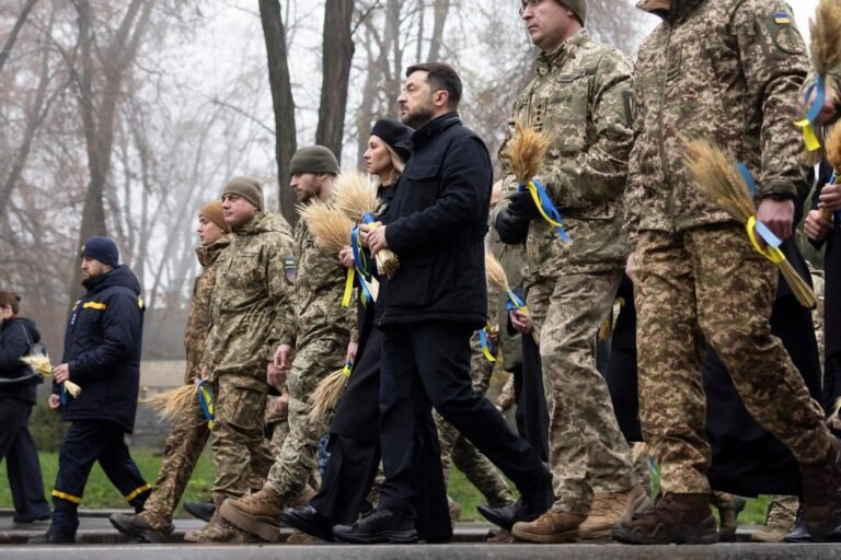Ukrainian President Volodymyr Zelensky and his wife, Olena Zelenska, visit the Holodomor Genocide complex of the National Museum in Kyiv on Saturday. Photo: Ukrainian Presidential Press Service via EPA