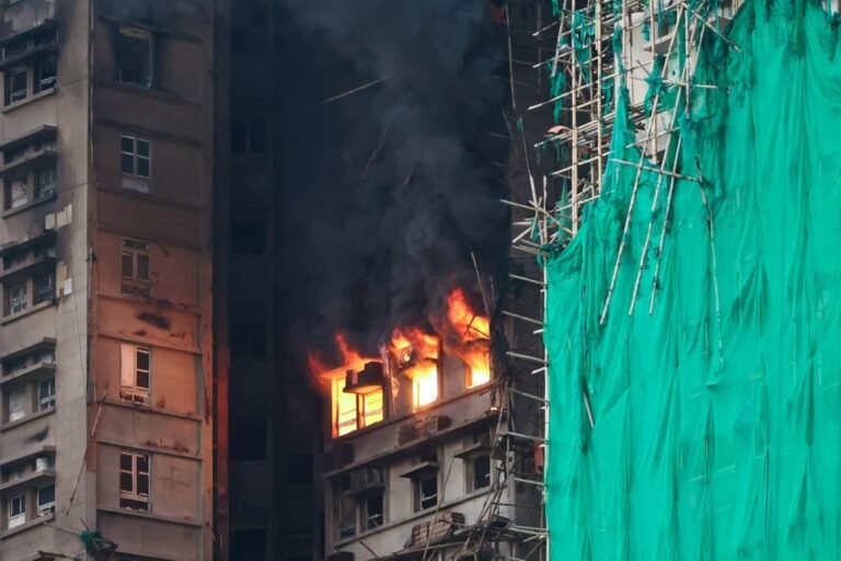Flames and smoke billow from the windows of a flat at Wang Fuk Court. Photo: Dickson Lee