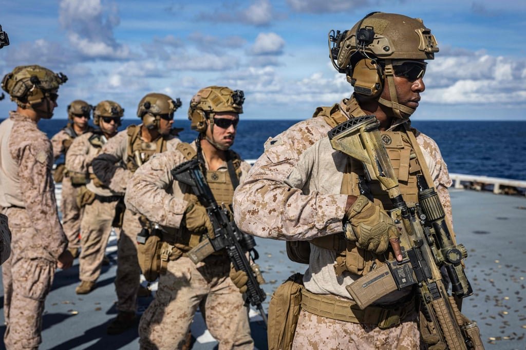 US Marines prepare to engage targets during a deck shoot last month in the Caribbean Sea. Photo: AFP