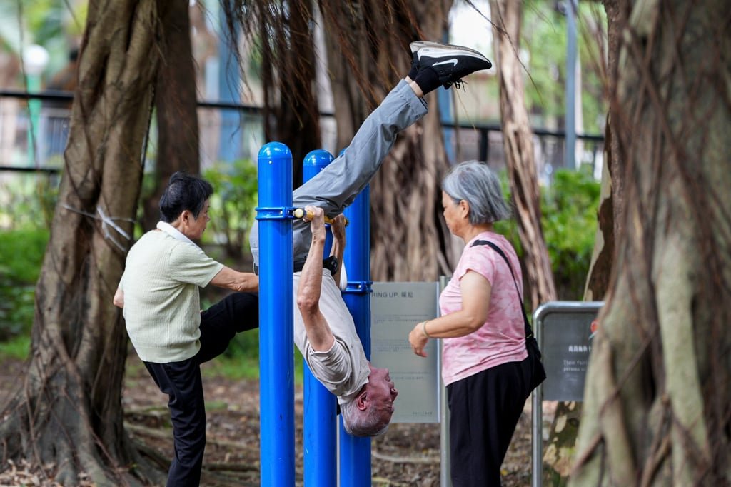 Opinion | Hong Kong should see the silver economy as a golden opportunity 4 An elderly man hangs upside down on a horizontal bar during his morning exercise in Fanling on August 17, 2025. Photo: Eugene Lee
