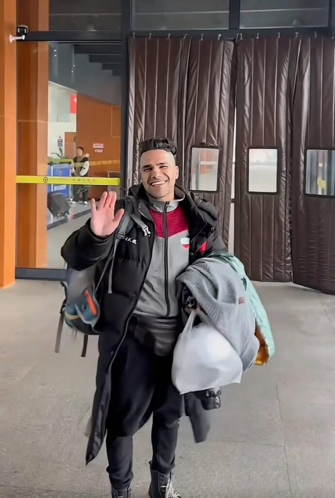 Iran boxing coach leaves China job, returns home to be with family despite risks 10 Boxing coach Saeed, above, waves as he begins his journey back to Iran. Photo: Baidu