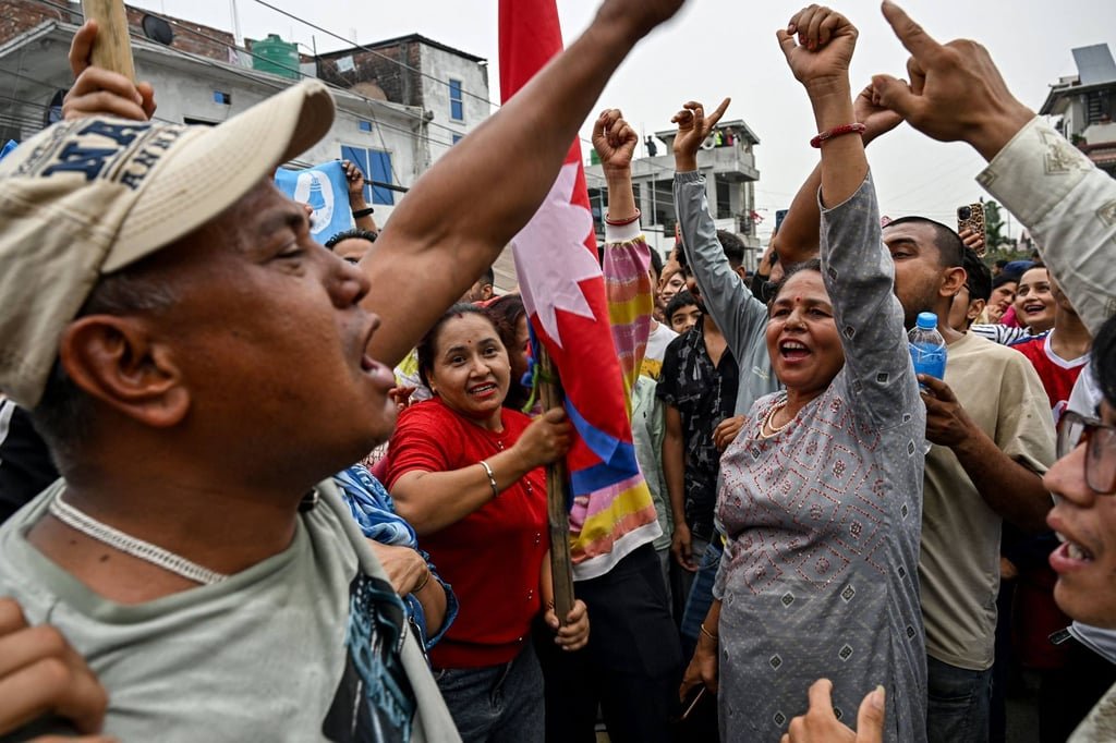 Nepal election: rapper-turned-politician Balen Shah beats former prime minister 9 Supporters of Balen Shah and the Rastriya Swatantra Party (RSP) celebrate outside a counting centre on Saturday. Photo: AFP