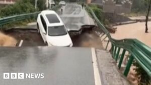 China: Car swept away after bridge collapse 2 China: Car swept away after bridge collapse