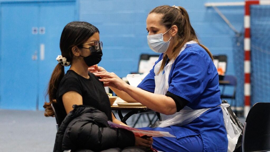 Teenagers from 15 should be given free meningitis B vaccine, say experts 10 A student receives the Meningitis B vaccine at the University of Kent sports hall on March 19, 2026 in Canterbury, England.